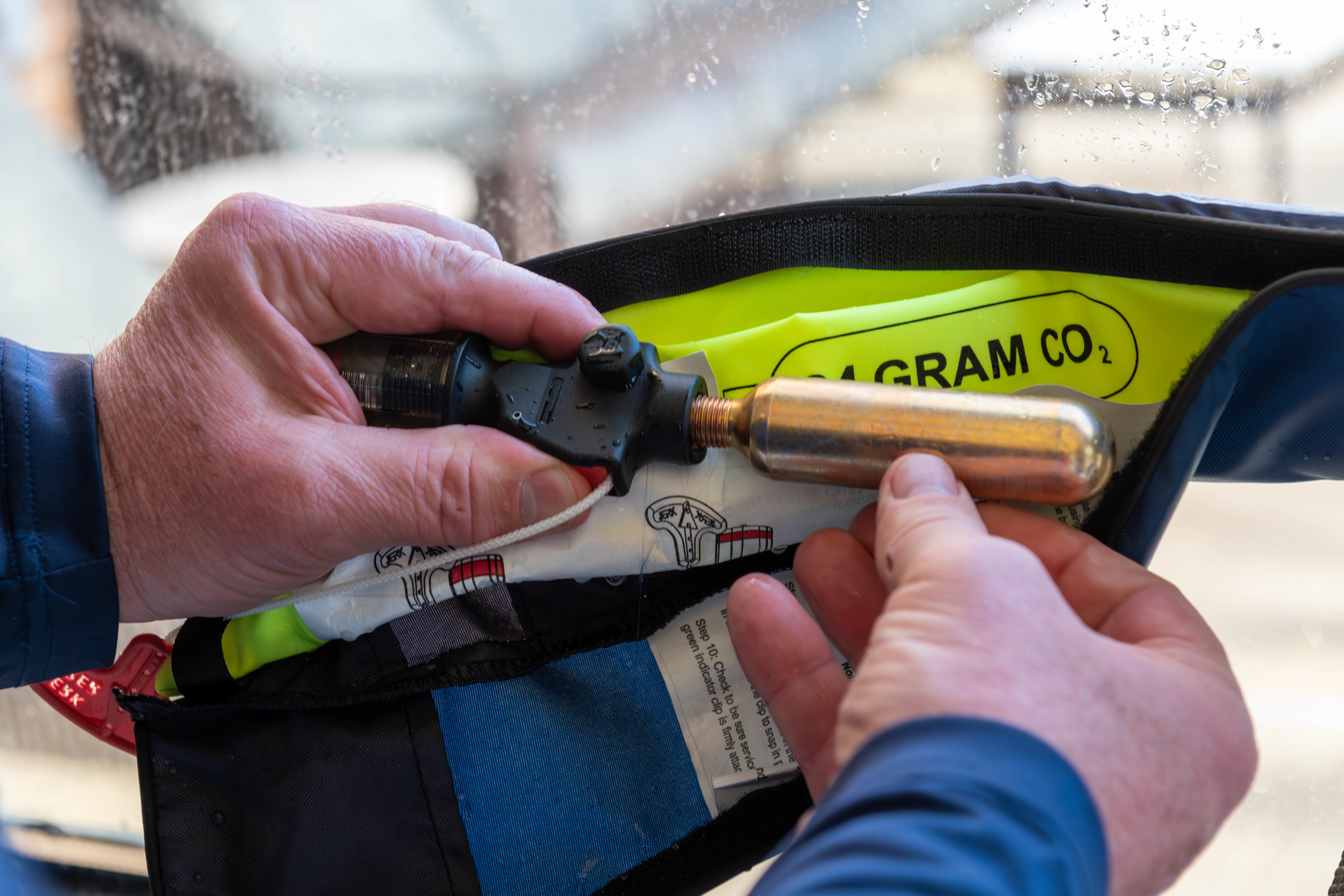 Inspecting the CO2 cylinder on inflatable life jackets is an easy annual task. 